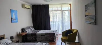 a hospital room with a bed and a window at Sun Wave Apartment near the Sea in Sveti Vlas