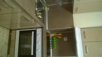a kitchen with a sink and a counter top at Apartamenti Zhelezovi in Pomorie