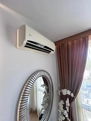 a room with a mirror and a air conditioner at Sea Home 1 in Sunny Beach