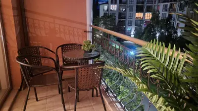 a balcony with a table and chairs and a window at Palma Beach in Harmony Suites 2,3 in Sunny Beach