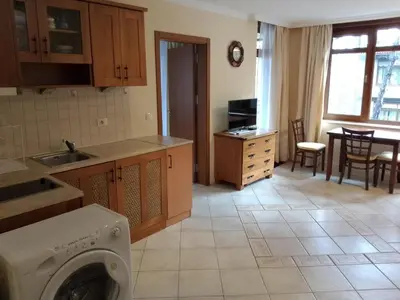 a kitchen with a washer and dryer in a room at Трёхкомнатные роскошные апартаменты у моря в Санта Марина in Sozopol