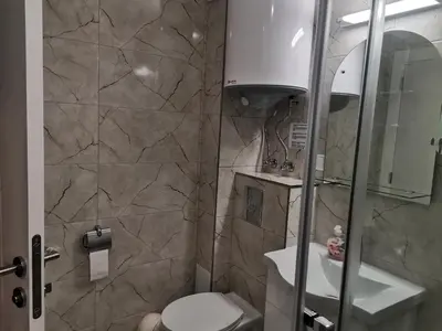 a bathroom with a toilet and a sink at Polarstar Beach Bulgarien Sveti Vlas in Sveti Vlas