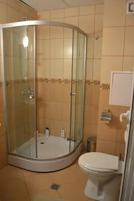 a bathroom with a shower and a toilet at Grand Kamelia Apartment in Sunny Beach