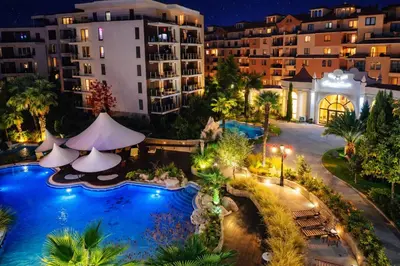 an overhead view of a resort pool at night at Harmony Suites-1 Private Apartment 42А in Sunny Beach