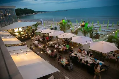 an overhead view of a restaurant with people sitting at tables at Апартамент 8 in Varna City