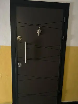 a black door with a lock on it at Room de Port in Burgas City