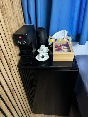 a desk with a printer and a box on it at Room de Port in Burgas City