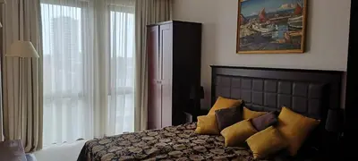a bedroom with a bed and a large window at Barcelo Royal Beach in Sunny Beach