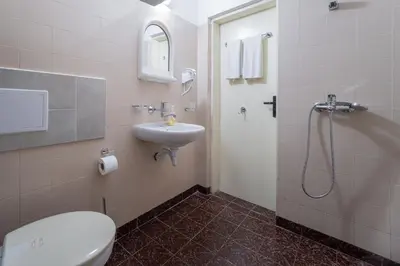 a bathroom with a toilet and a sink and a shower at Citybox - Shipka in Varna City