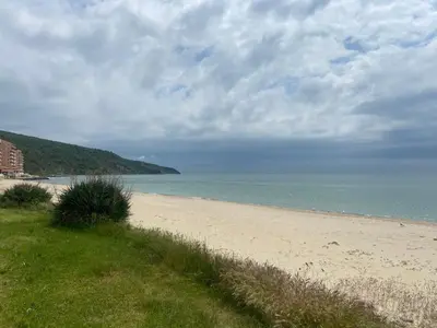a sandy beach with the ocean in the background at Private Villa in Elenite Resort in Atanasovo