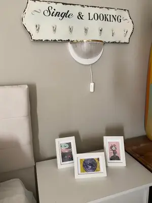 a sign on a wall with pictures on a table at Spacious Modern Two-Bedroon Suite in Elit 1 Complex in Sunny Beach