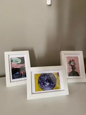 three pictures in frames sitting on a table at Spacious Modern Two-Bedroon Suite in Elit 1 Complex in Sunny Beach
