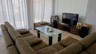 a living room with a couch and a coffee table at вила Мариела - villa Mariela in Yunets