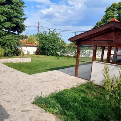 a gazebo with a pavilion in a park at Коларова къща in Avren