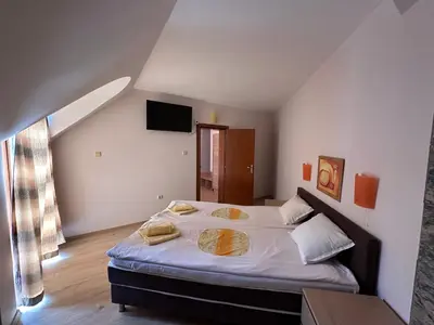 a bedroom with a large bed in a room at Hotel Energy in Kiten