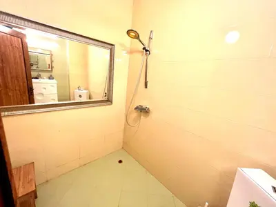 a bathroom with a shower with a mirror at Arkutino Beach in Burgas City