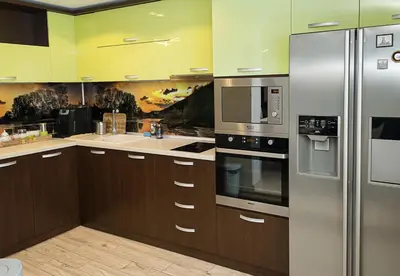 a kitchen with wooden cabinets and stainless steel appliances at Modern 2-Level Apartment with Balcony in Varna by Flat Mаnager in Varna City
