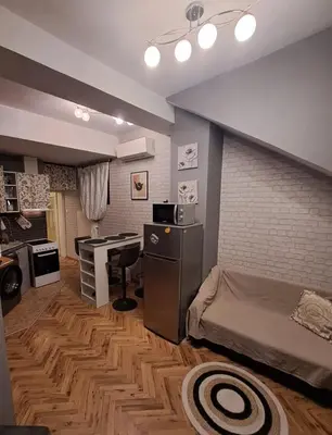 a bedroom with a bed and a desk in it at Varna city breaks 1 in Varna City