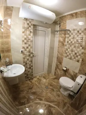 a bathroom with a toilet and a sink at Salt Lake Studio in Pomorie
