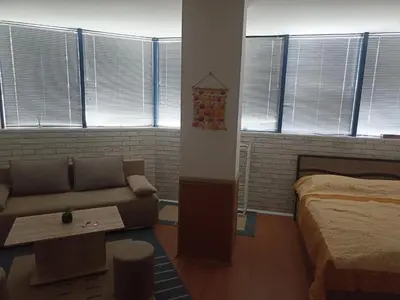 a living room with a couch and a bed at Rainbow Luci in Sunny Beach
