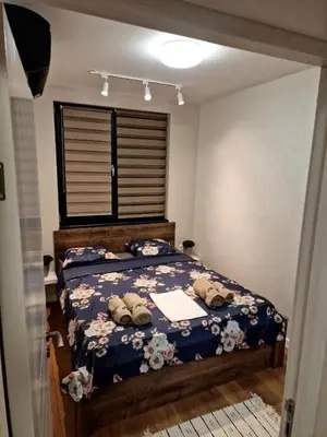 a bedroom with a bed with two pillows on it at Varna Hidden Gem in Varna City
