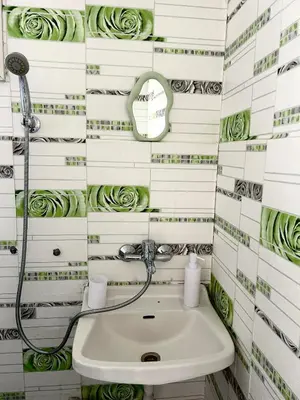 a bathroom with a sink and a shower at Бунгала Мишел in Varna City