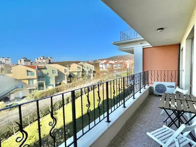 a balcony with a view of a city at Prestige Fort Aparthotel - Private apartment - BSR - 2 in Sveti Vlas