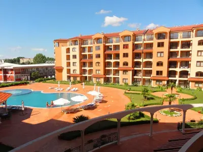 a large apartment complex with a swimming pool and a building at Menada Diamant Apartments in Sunny Beach