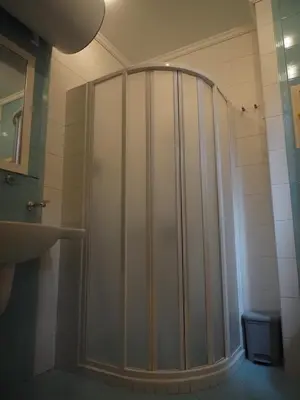 a shower with a glass door in a bathroom at Studio Sea Breeze Veranda in Santa Marina in Sozopol