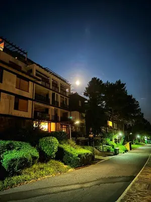 an apartment building at night with a street at Studio Sea Breeze Veranda in Santa Marina in Sozopol