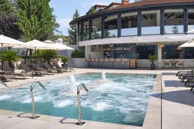 a pool with a fountain in front of a building at Studio Sea Breeze Veranda in Santa Marina in Sozopol