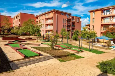 a park with playground equipment in front of buildings at Sunny Day 6 , Sunny beach, 3-Стаен апартамент in Tŭnkovo