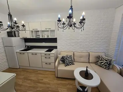 a living room with a couch and a table at A wonderful vacation home in Sunny Beach