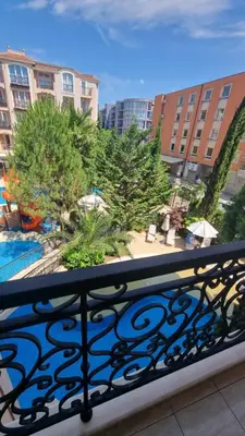 a balcony with a view of a pool and buildings at Romans Marin in Sunny Beach