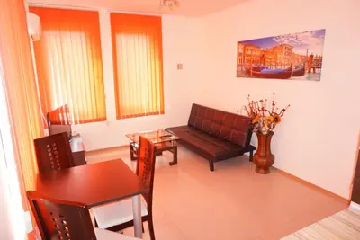 a living room with a couch and a table at Apartment Patriarh Evtimiy in Burgas City