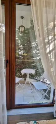 a view of a patio from a window with a table at 1 bedroom Harmony Monte Carlo in Sunny Beach