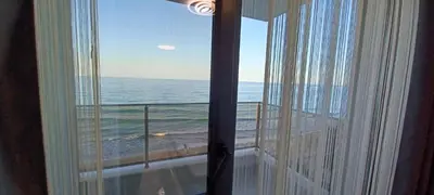 a view of the ocean from a room with a window at Magic Home in Obzor