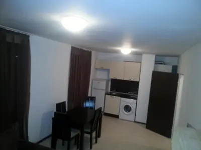 a small apartment with a kitchen and a dining room at Apartment Nova in Burgas City