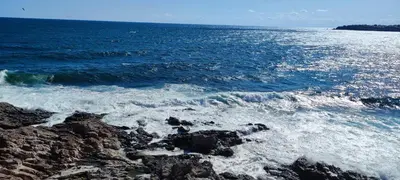 a view of the ocean from a rocky beach at Sozopol Sunrise in Sozopol