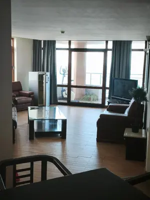 a living room with a couch and a coffee table at Sozopol Sunrise in Sozopol