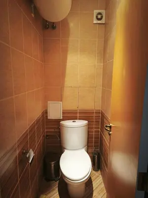 a bathroom with a toilet in a small room at Sozopol Sunrise in Sozopol
