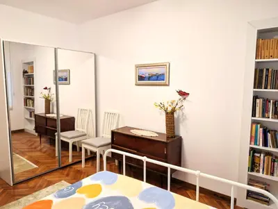 a room with a mirror and a table and chairs at Seaside luxury residence in Varna City