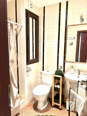a bathroom with a toilet and a sink at Студио в Затворен Комплекс Green in Sozopol