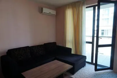 a living room with a couch and a coffee table at SUN GATE - Julia in Sunny Beach