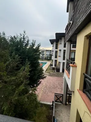 a view of a pool from a balcony of a building at Relaxing apartment - 100 meters from the sea in Chernomorets