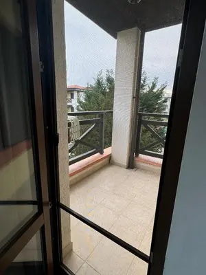 an open door to a balcony with a view at Relaxing apartment - 100 meters from the sea in Chernomorets