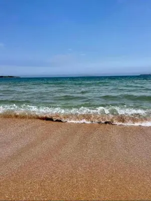 a sandy beach with the ocean in the background at Relaxing apartment - 100 meters from the sea in Chernomorets