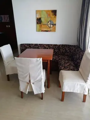 a table and two chairs and a table and a couch at Apartment Slantse in Sozopol