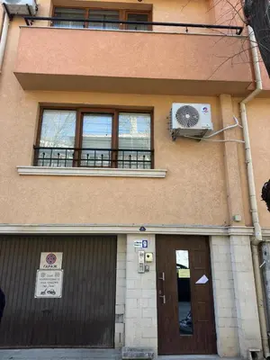 a building with a balcony and a fan at Sea in Varna City