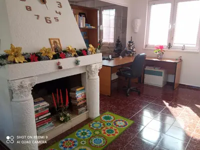 a living room with a fireplace and a desk at International 2-star spacious 88 sq m apartment in Varna City